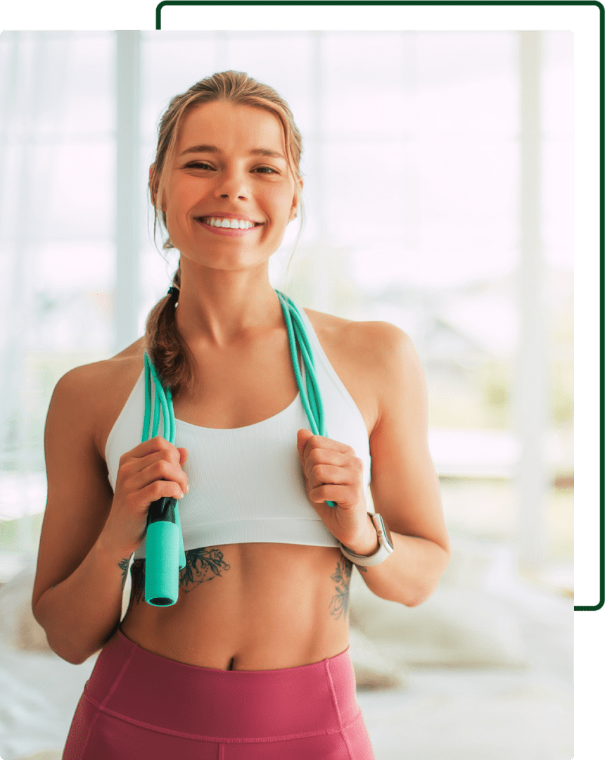 A woman holding a jump rope in her hands.