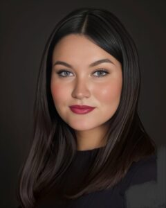 A woman with long black hair and red lipstick.