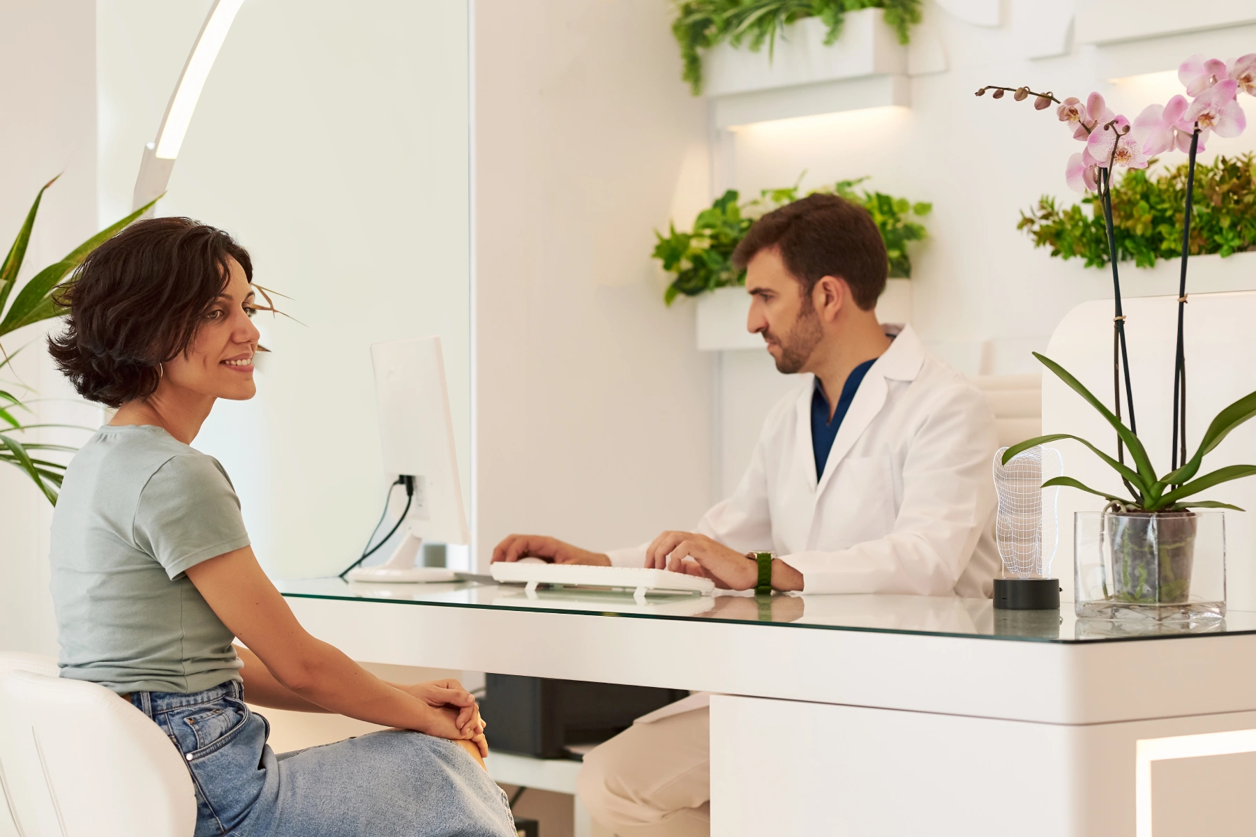 Primary care doctor in San Tan Valley providing personalized patient consultation in a modern clinic